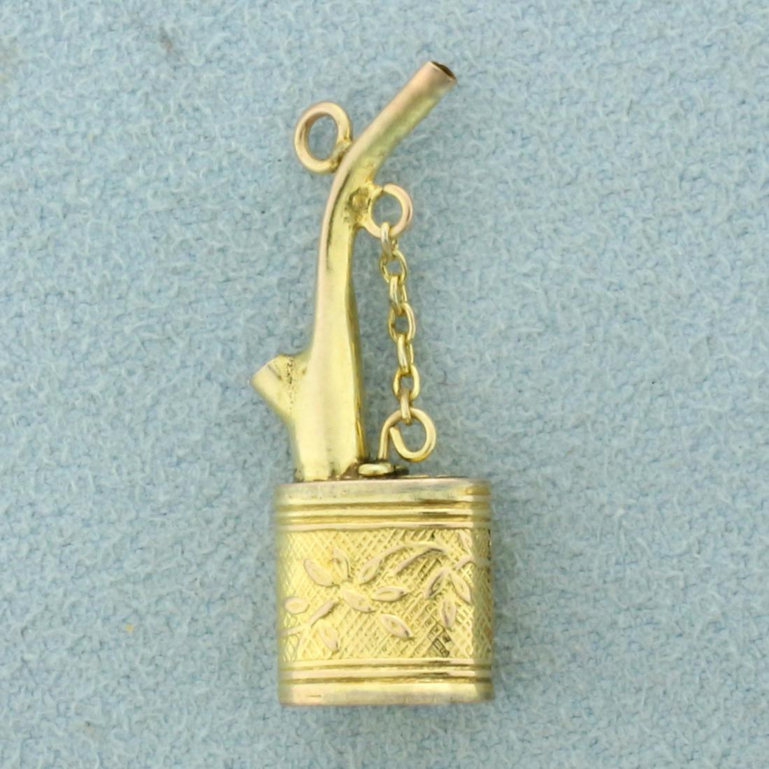 Antique Oil Can Pendant in 14K Yellow Gold: In 14K Yellow Gold. 1 inch long, 3/8 inch wide. 1.2g.