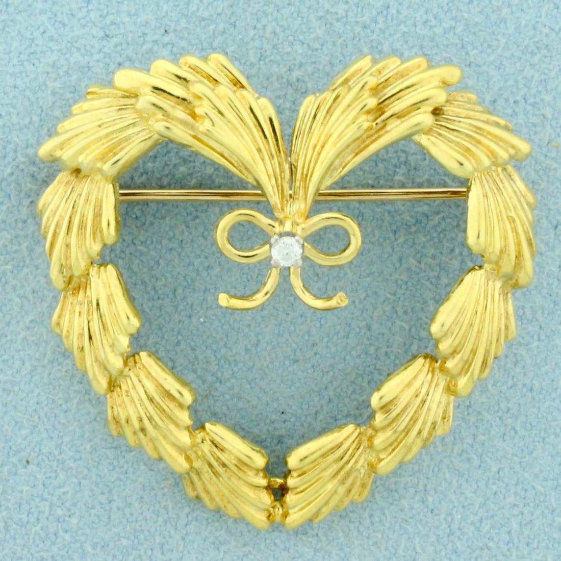 Authentic Cartier Diamond Heart Pin in 18K Yellow Gold: In 18K Yellow Gold. Contains one high quality .03ct Diamond, VVS clarity/F color. 1 1/4 inches long and wide. 9.5g