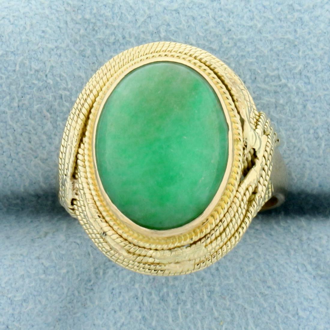 7ct Natural Jade Solitaire Ring in 14K Yellow Gold: In 14K Yellow Gold. Contains a high quality natural 14x11mm oval cut cabochon Jade gemstone with beautiful bright green color. Size 8 1/4. 8.0g