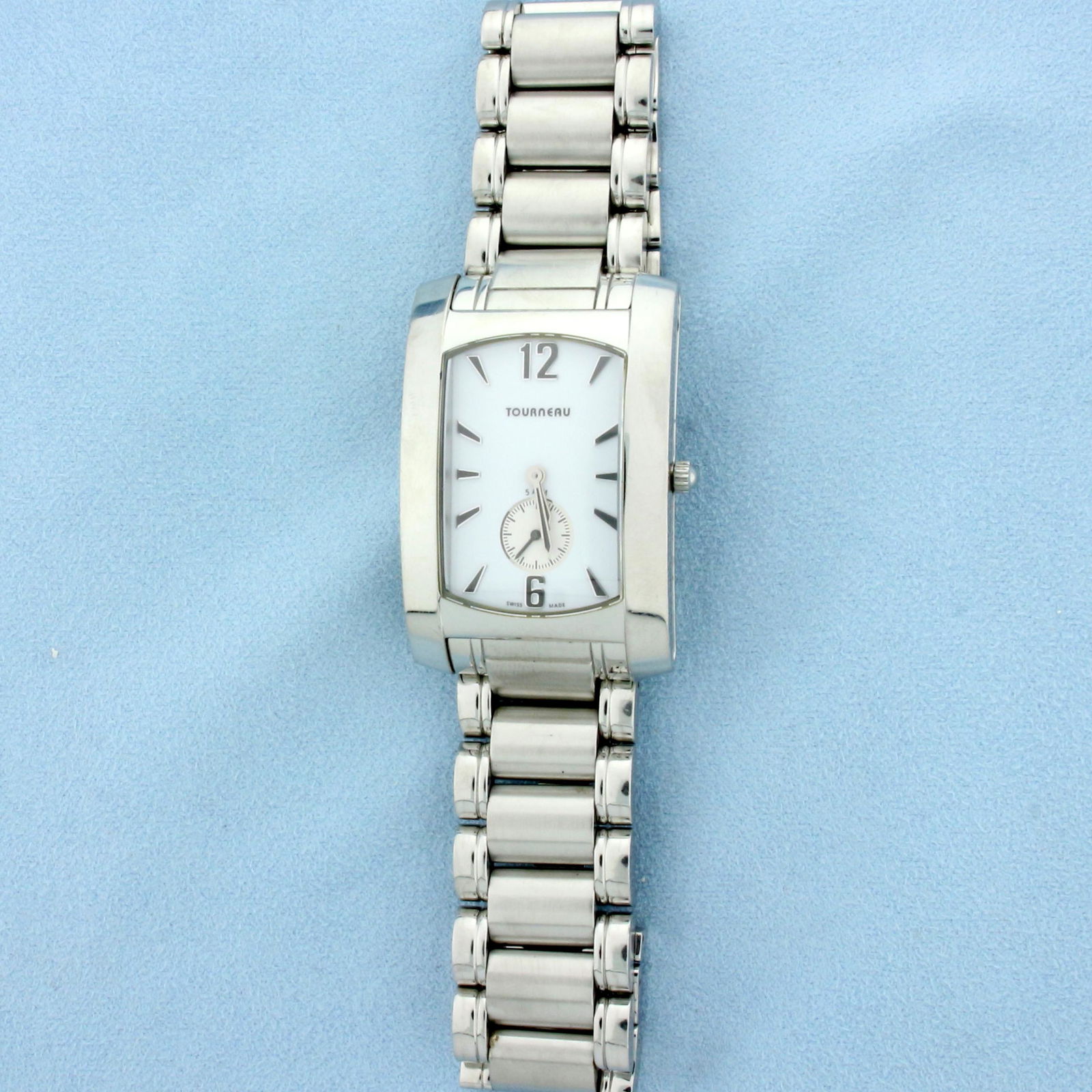 Mens Tourneau Classic Stainless Steel Wrist Watch: Stainless steel. Swiss made quartz movement, runs great. Case is 29 x 44mm. White dial, 5 ATM, sapphire crystal. Hidden double fold clasp. Extra links included. Great condition, no scratching on cryst