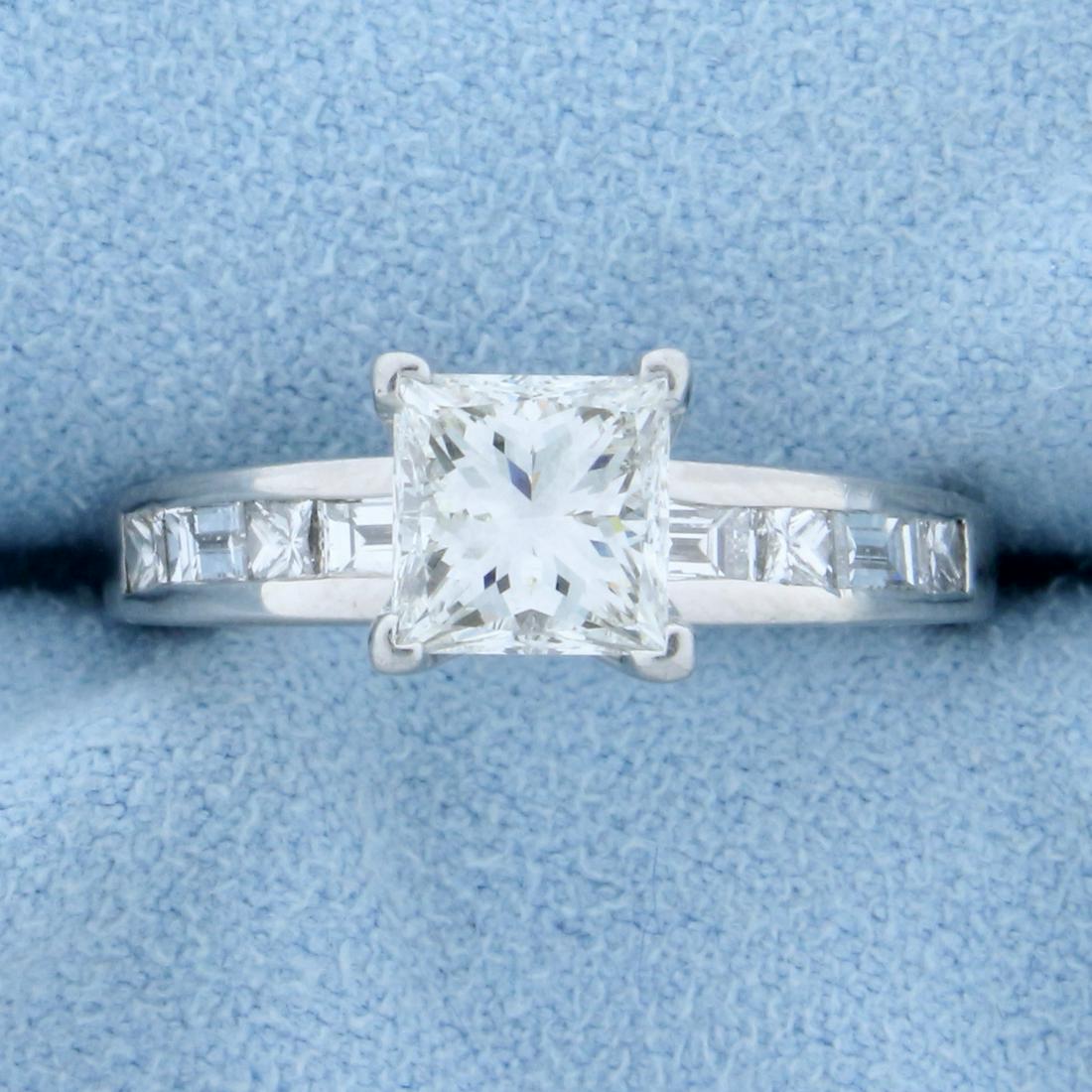 1.75ct TW Princess Cut Diamond Engagement Ring in Platinum: In Platinum. Contains a very high quality 1.25ct Princess cut center diamond, VVS Clarity/G color. Also containing 1/2 ct TW of princess and emerald shaped diamonds in shank of similar high quality. S