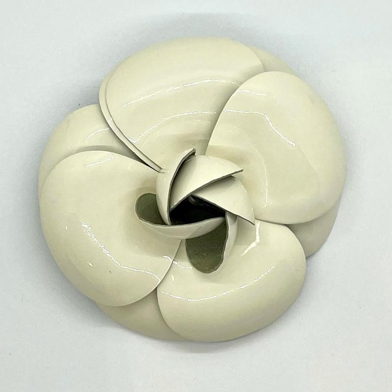 Authentic Chanel White Patent Large Camellia Flower Brooch Pin: Guaranteed authentic in off white patent. Measures approx. 4" in diameter. Rare find of a classic Chanel piece. In excellent condition, rarely worn. Hardware in excellent condition with an authenticit