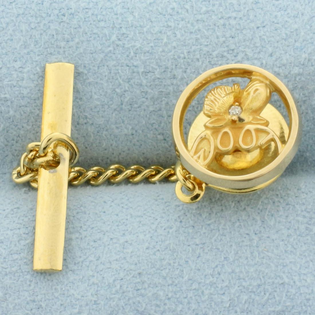 Loyal Order Of Moose Diamond Tie Tack in 14k Yellow Gold: 14k yellow gold. 1/2 inch diameter. Contains one .01ct diamond, VS clarity/G color. Back is plated gold. 3.8g.