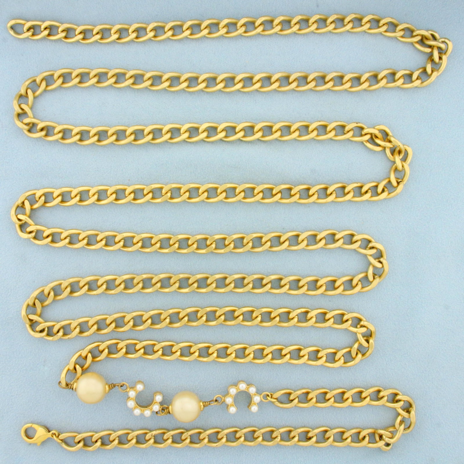 Vintage Chanel Ultra Long "COCO" Faux Pearl And Curb Goldtone Chain Necklace: Guaranteed Authentic. Freshly refinished at Chanel. Marked "Chanel" "OL A" "Made in France". 60 inches long with matte gold finish curb chain. Champagne golden baroque gripoix faux Pearls and white fa