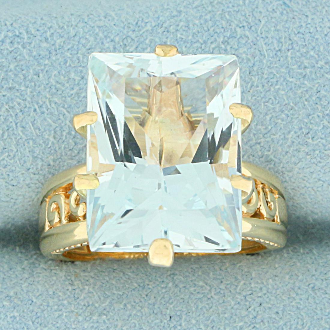 15ct Sky Blue Topaz Solitaire Ring in 14K Yellow Gold: In 14K Yellow Gold. Contains one high quality natural 16.2x12.1mm Sky Blue Topaz gemstone with light blue color and excellent clarity. Size 7 1/2. 9.6g.