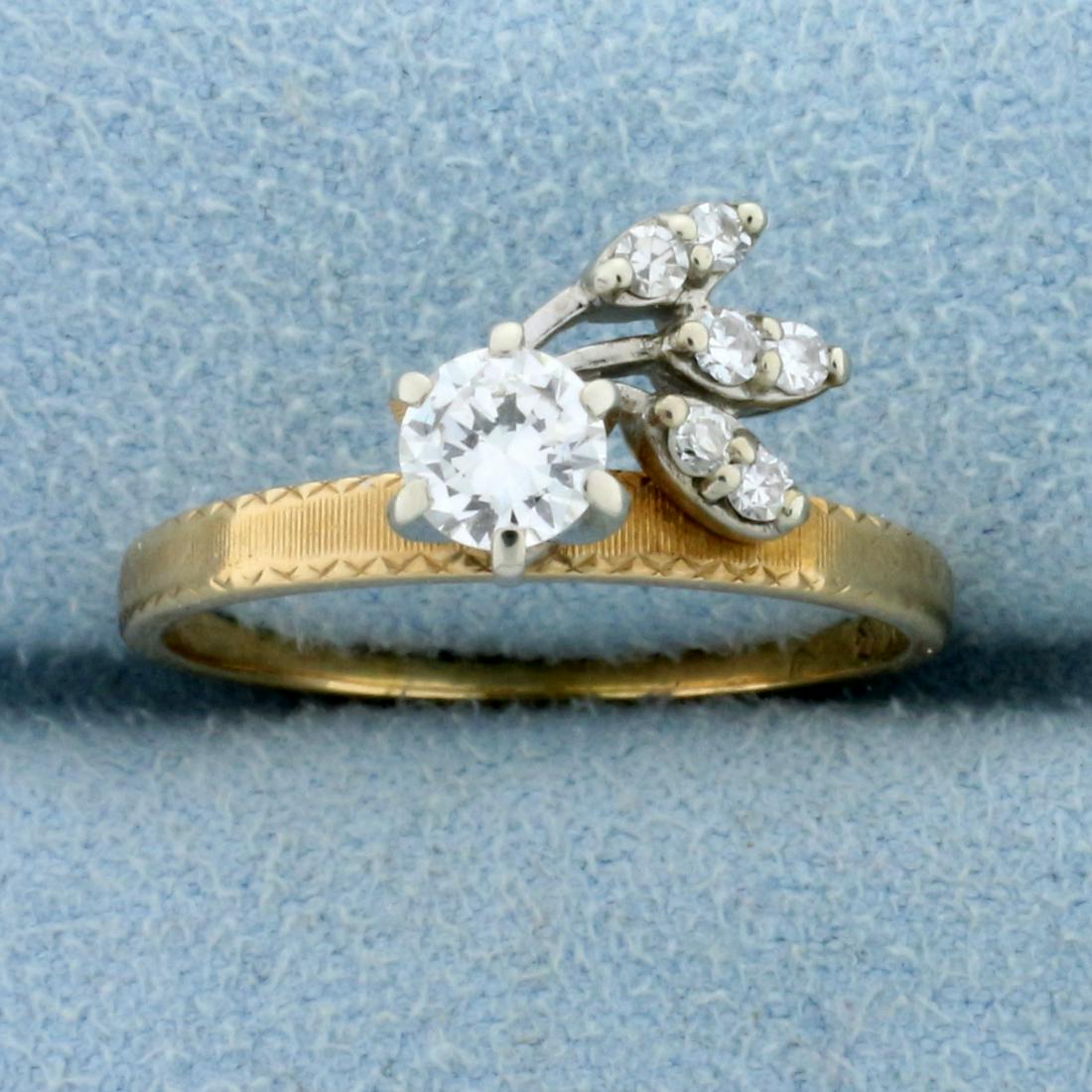 Vintage 1/2 ct Diamond Ring in Unique Setting in 14k Gold: In 14K yellow and white gold. The center diamond is a high quality round brilliant .35 ct, G color/VS clarity. There are six .03 ct side stones that are also G color/VS clarity. Size7.5 2.6g