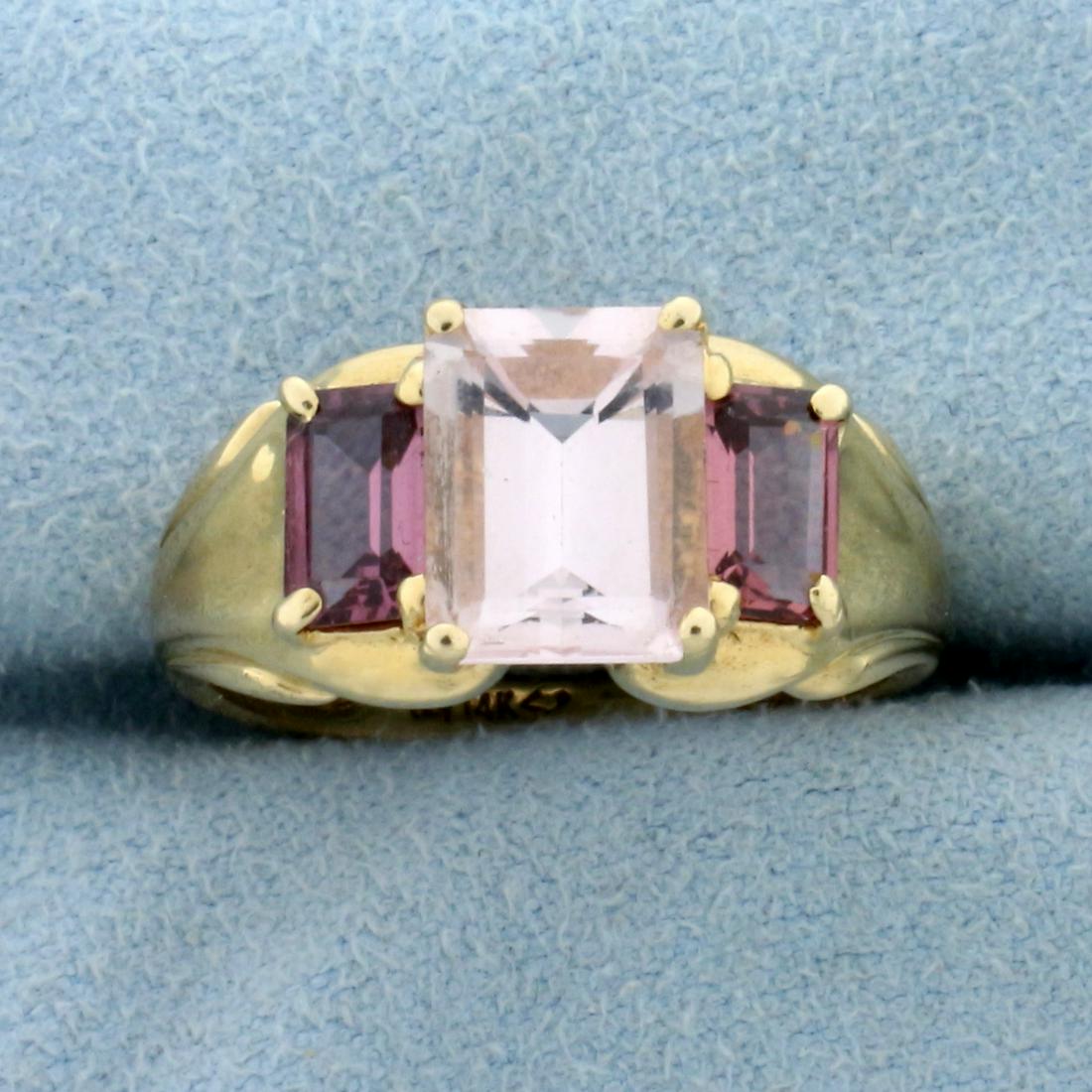 3.5ct TW Natural Morganite Ring in 14K Yellow Gold: In 14K Yellow Gold. Contains one natural 2.5ct emerald cut high quality Morganite gemstone with light pink color and excellent clarity. Also contains two high quality 1/2ct emerald cut Morganite gemst
