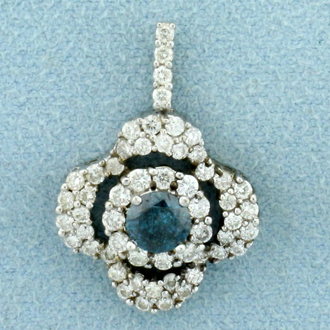 1 1/3ct TW Blue and White Diamond a Pendant in 18K White Gold: In 18K White Gold. Contains one high quality 1/2ct round Blue Diamond with beautiful intense blue color. Also contains forty .02ct and four .01ct round cut Diamonds, SI clarity/G color. 1 inch long. 5