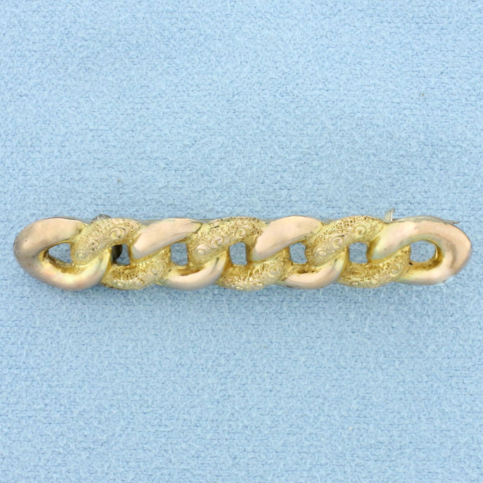 Antique Victorian Curb Link Pin in 9K Yellow and Rose Gold: In 9K Yellow and Rose Gold. 1 3/4 inches long, 9mm wide. Hallmarked English 1899 or earlier. Intricate hand detail with chased yellow gold. 1.9g.