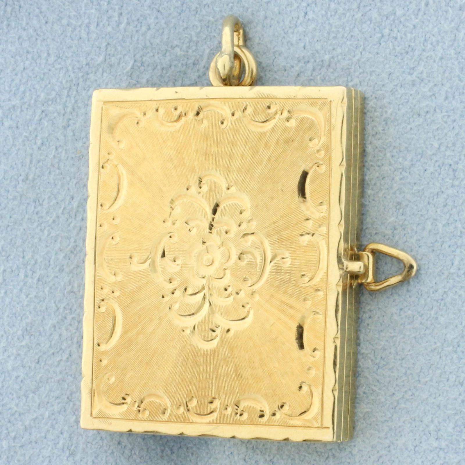 Large Vintage Mechanical Photo Book Locket Pendant in 14k Yellow Gold: 14k yellow gold 1 3/8 Inch long (including ring at top), 7/8 inch wide. Multi page phot book with lock to keep book closed. Hand etched design on cover. Rare find in excellent condition. 13.0g.