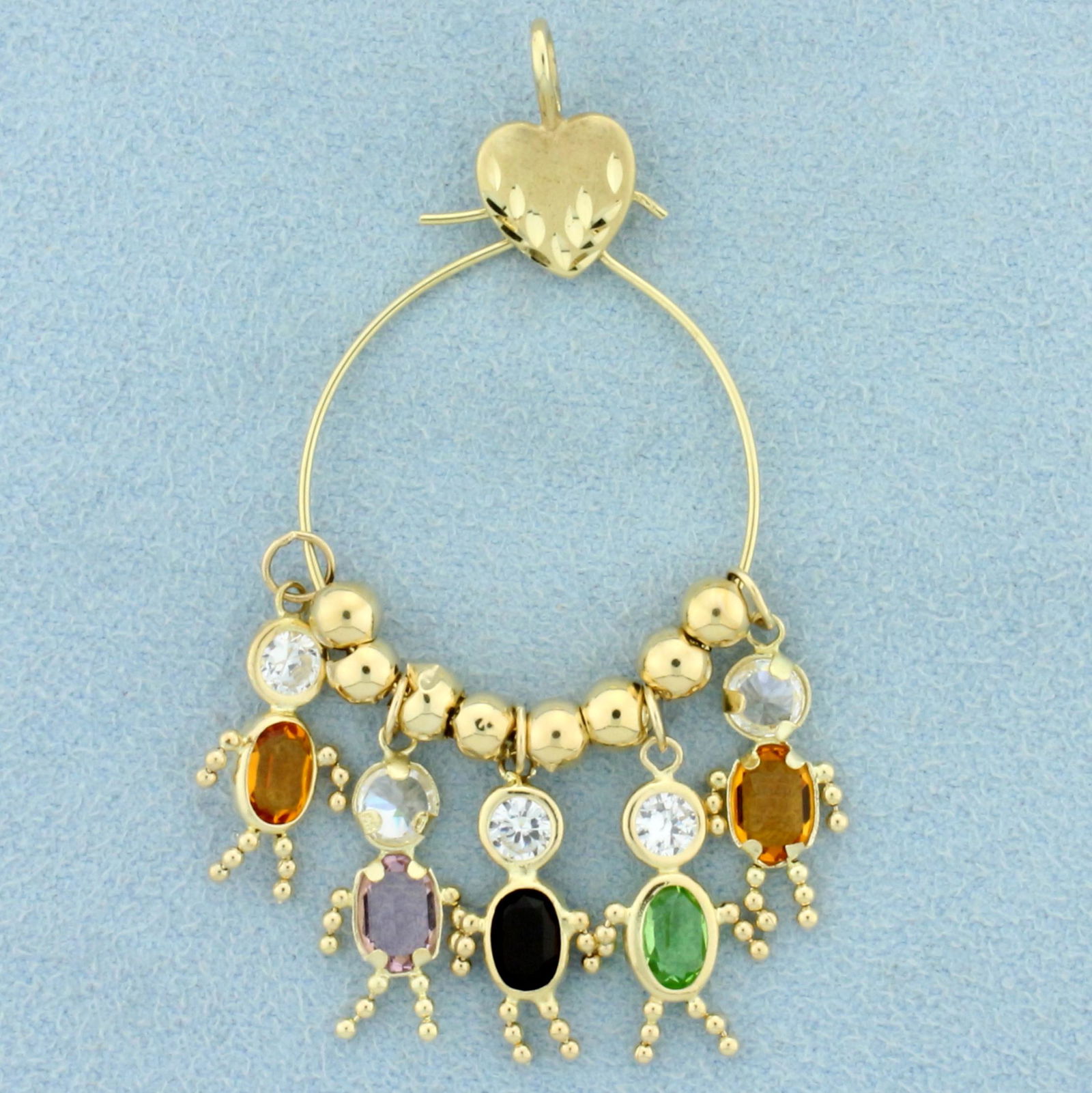 Heart Charm Pendant with Children Charms in 14K Yellow Gold: In 14K Yellow Gold. "Children" are 5/8 inches long. Multi-colored gemstones with CZs. 2 1/4 inches long. 1 inch wide. 3.4g