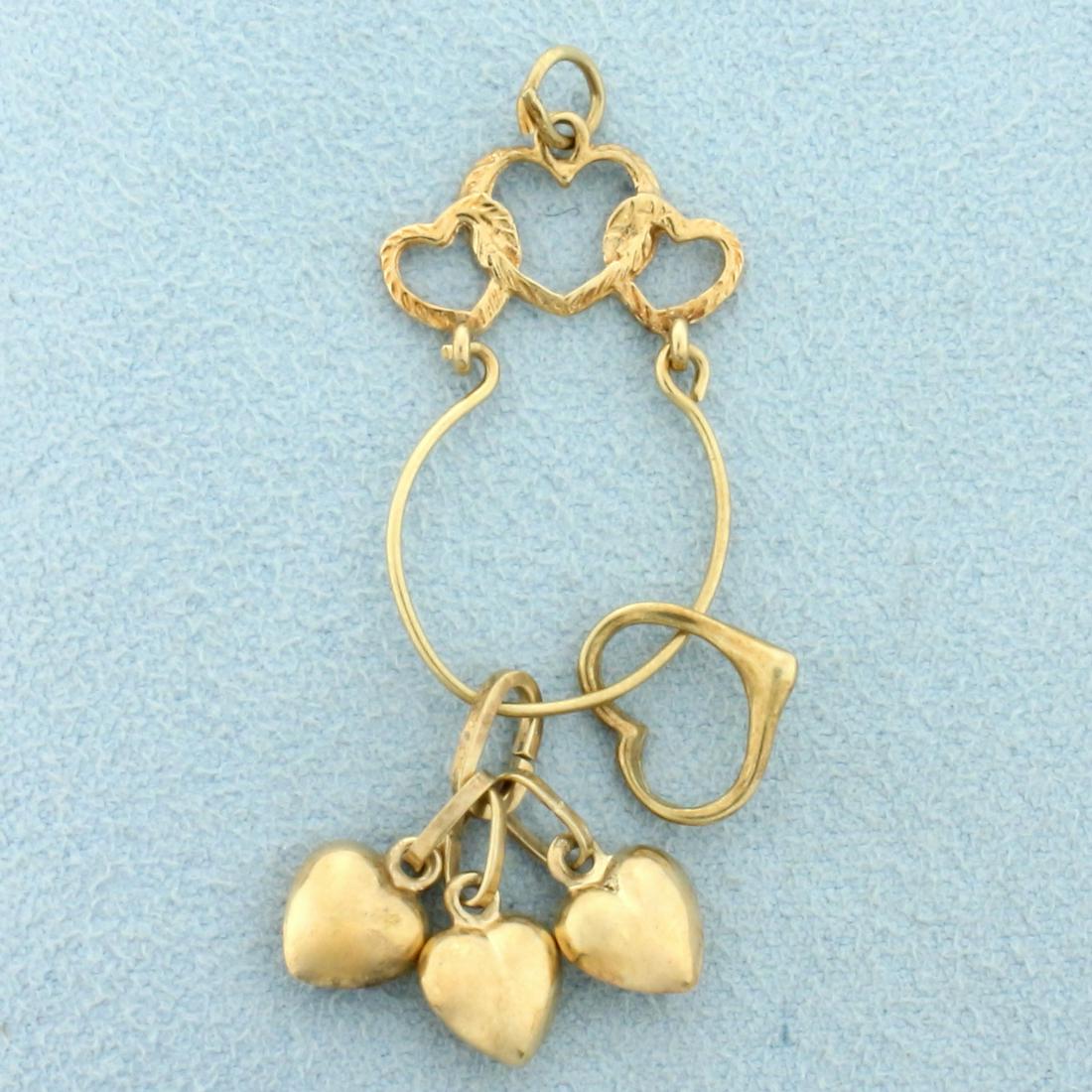 Heart Charm Holder Pendant With Charms in 14K Yellow Gold: In 14K Yellow Gold. 1 7/8 inches long including jump ring, 3/4 inch wide. 2.1g.