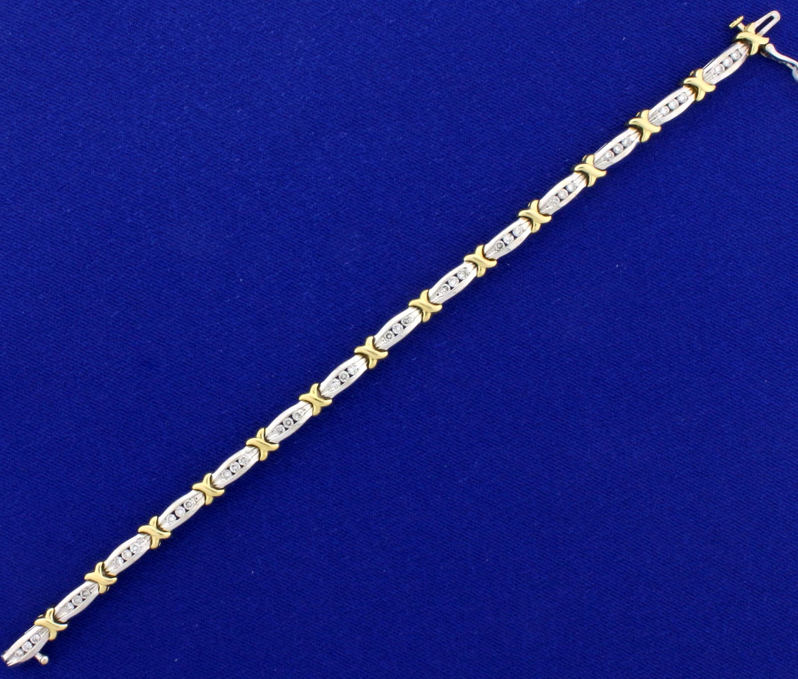 1.25ct TW Diamond Tennis Bracelet in 14k White and Yellow Gold: In 14K yellow and white gold, it contains 1.25ct total weight of high quality diamonds, SI clarity/H color. It is 7 inches long with a safety clasp. 14.6g