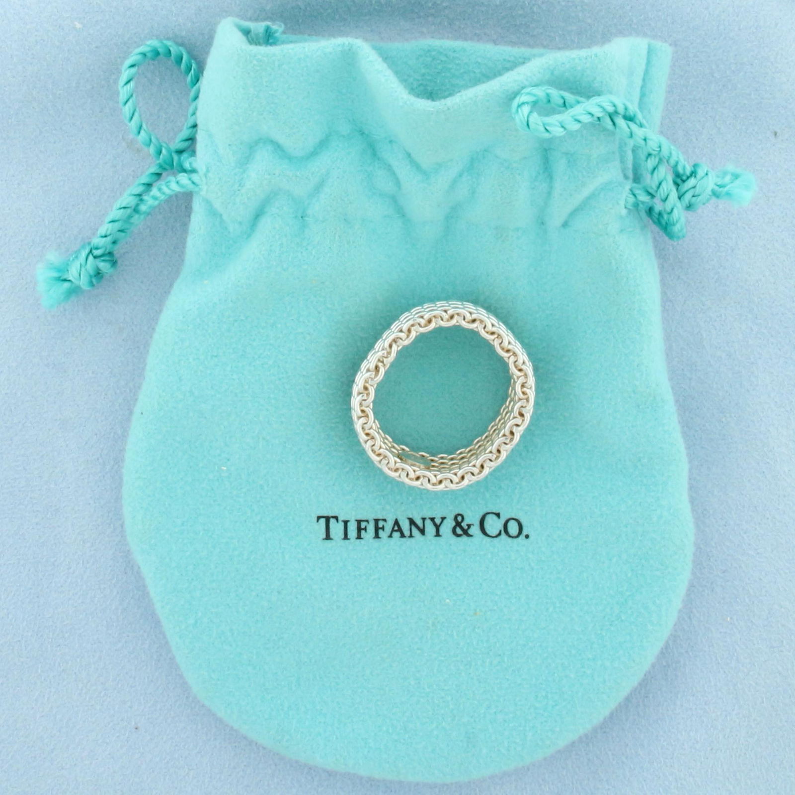 Tiffany and Co. Somerset Basketweave Mesh Ring in Sterling Silver: In sterling silver. Guaranteed authentic. Includes Tiffany and Co. Bag. Ring measures 10mm wide and is size 10.5. Flexible ring with sturdy weave. 10.1g.