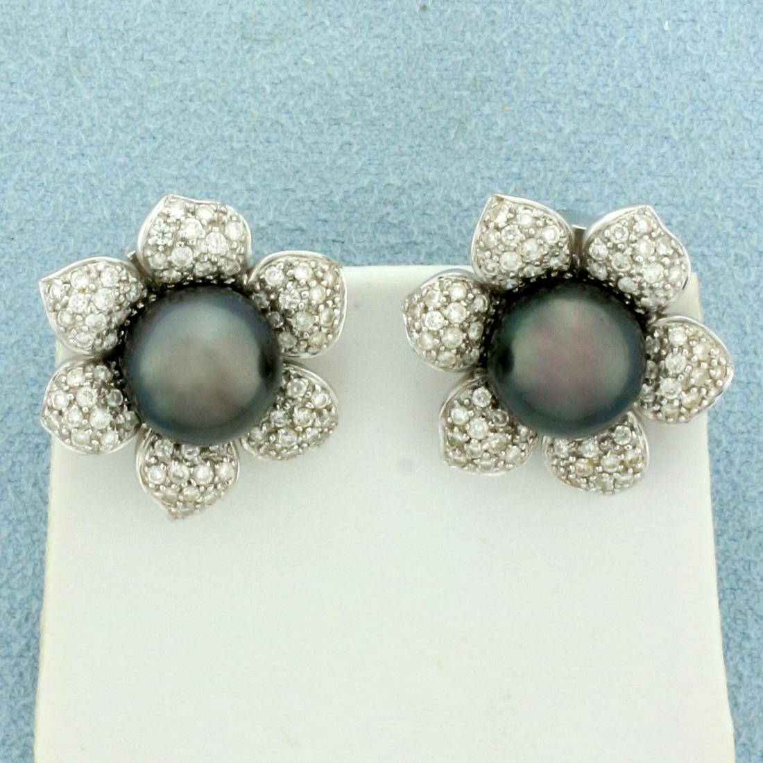 Designer Tahitian Pearl and Diamond Flower Button Earrings in 18k White Gold: In 18k white gold. Contains Two high quality 9.5mm Tahitian pearls with great iridescent peacock color and luster. Also contains 132 high quality diamonds, 1ct TW, SI clarity/H color. 21mm by 19mm ove