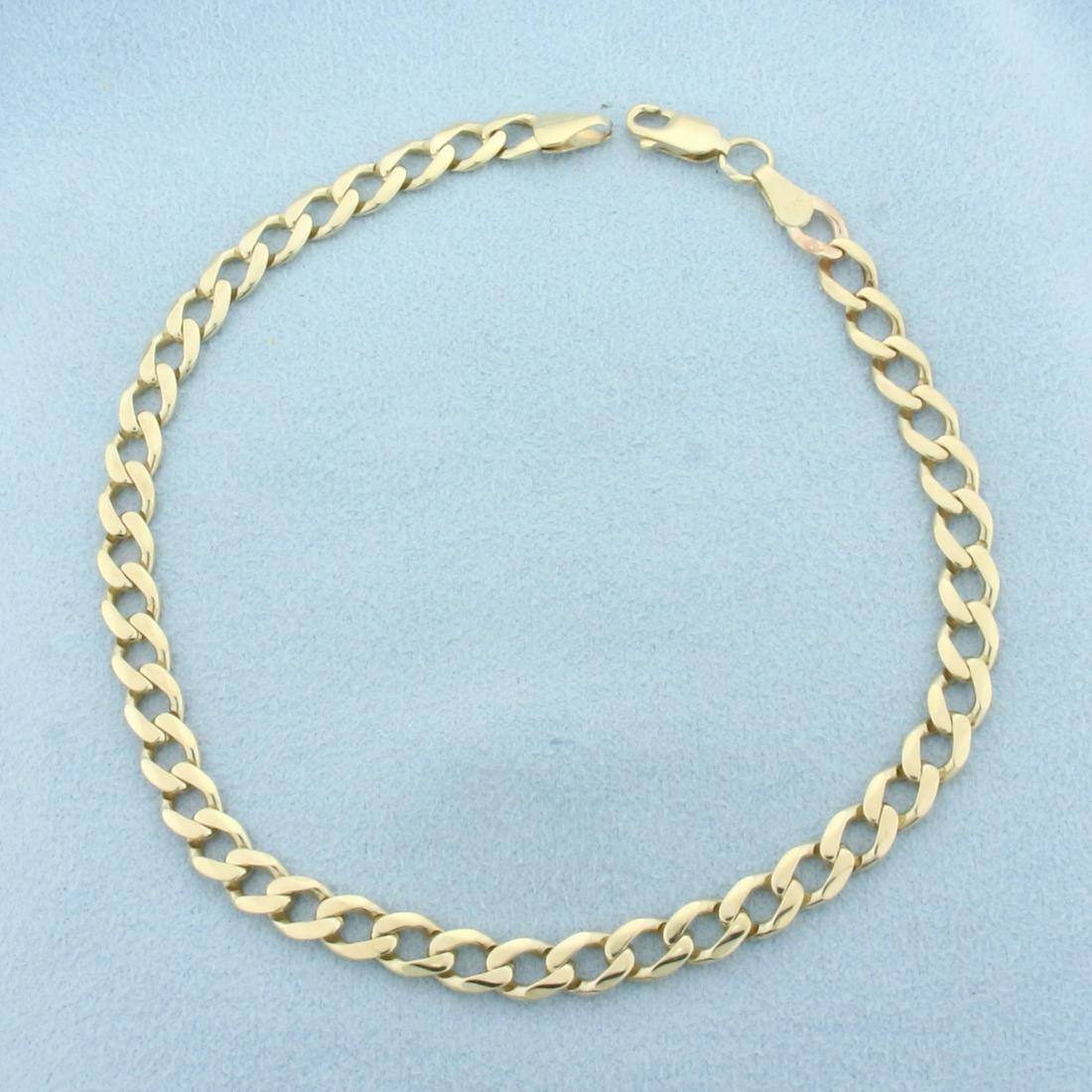 Curb Link Anklet in 14K Yellow Gold: In 14K Yellow Gold. 9 inches long, 5mm wide. Lobster clasp. 8.2g.