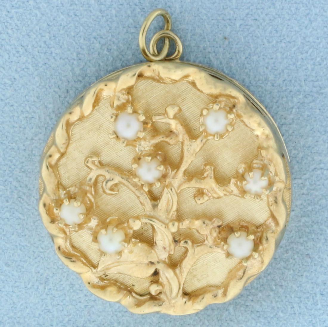 Vintage Tree of Life Pearl Photo Locket in 14k Yellow Gold: In 14k yellow gold. Contains 7 cultured pearls, 3mm each, with high luster. Approximately 1 1/8 diameter. Opens to fit up to 4 photographs. 18.0g.