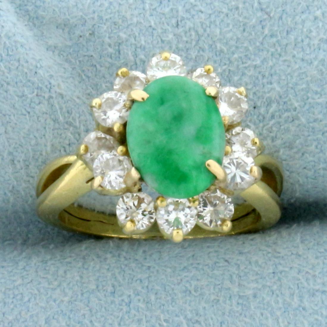 Jade and Diamond Halo Design Ring in 18K Yellow Gold: In 18K Yellow Gold. Contains a high quality natural 9x7mm oval Jade gemstone. Also contains twelve high quality .08ct round Diamonds, SI clarity/H color. Size 4. 5.0g