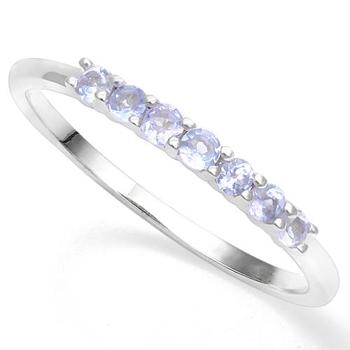 Tanzanite Stackable Ring in Sterling Silver: Round cut tanzanite gemstones, 1/4ctw, set in platinum over sterling silver ring. Can be worn alone or stacked with other rings. Size 8. 1.3g