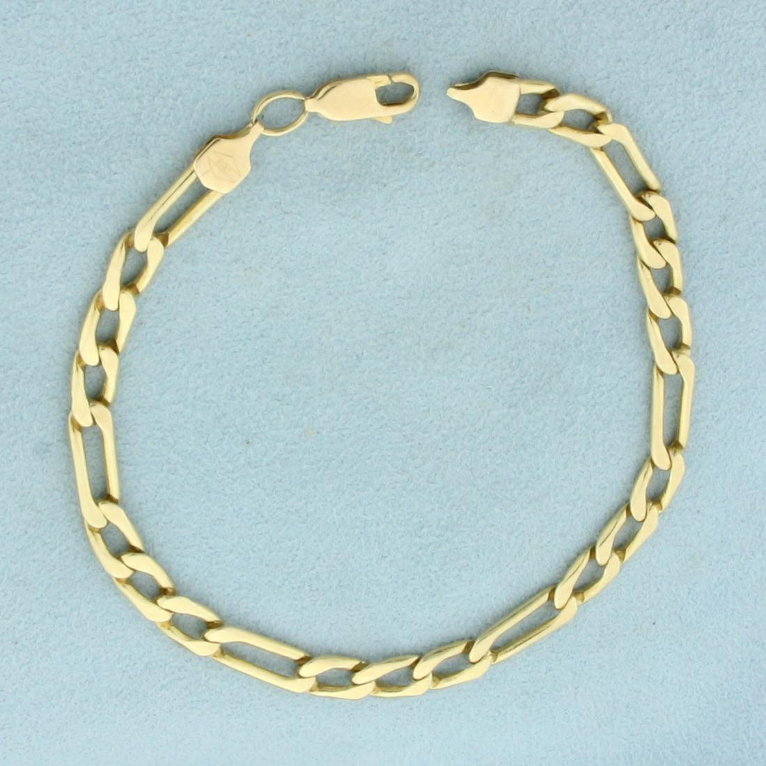 Figaro Link Bracelet in 10k Yellow Gold: In 14k yellow gold. 8 1/8 inch long and 5.2mm thick. Lobster clasp. 9.9g.