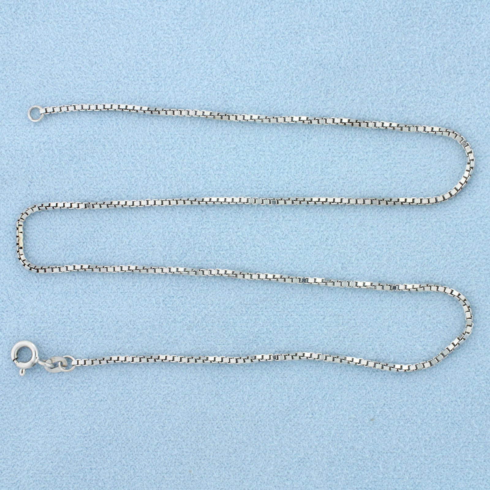 13 1/2 Inch Choker or Youth Box Link Chain Necklace in 14K White Gold: In 14K White Gold. 13 1/2 inches long, 1.1mm wide. Spring clasp. 3.3g.