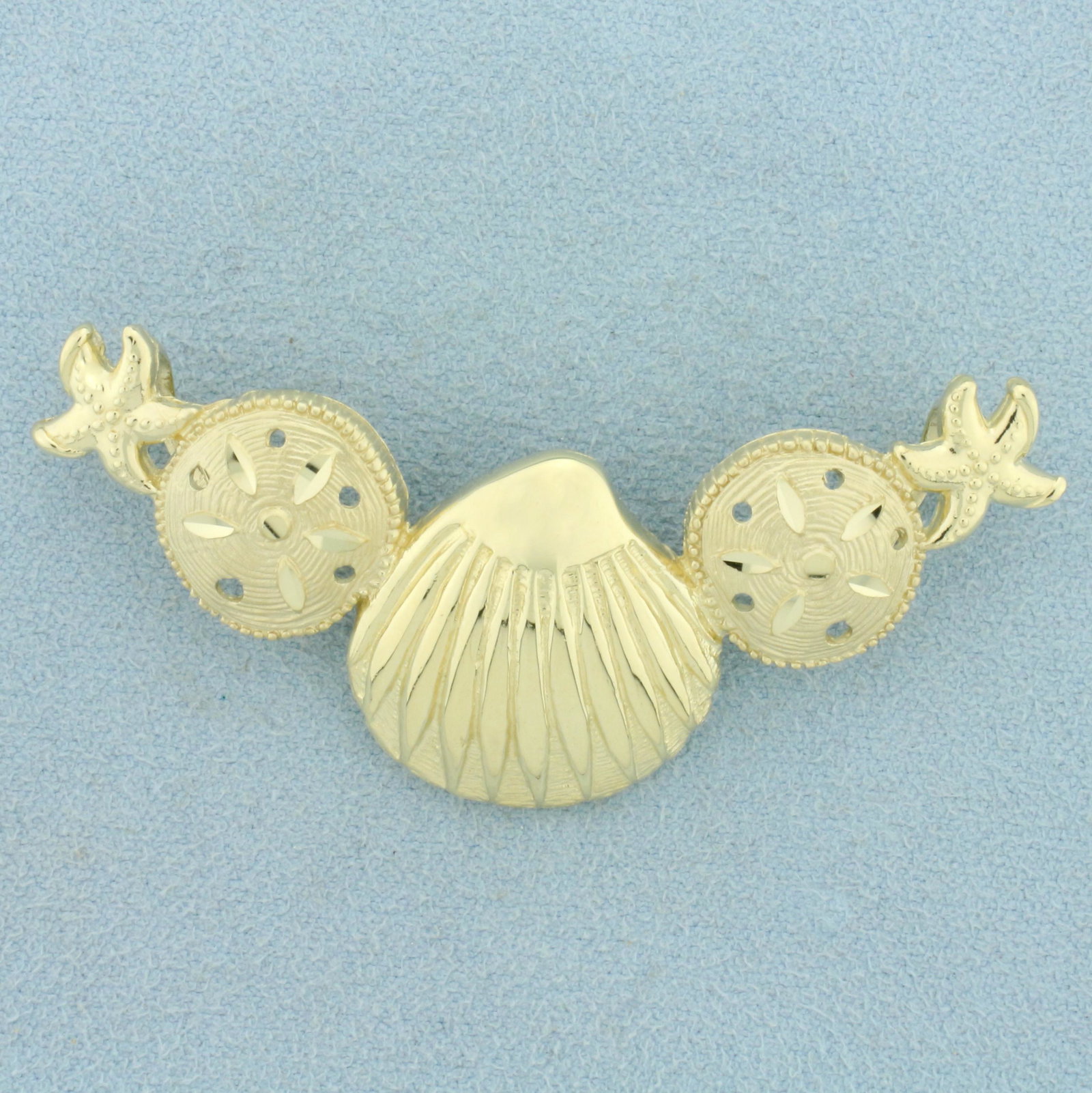 Seashell Slide Pendant in 14K Yellow Gold: In 14K Yellow Gold. 2 1/2 inches long, 7/8 inch wide . 11.3g.