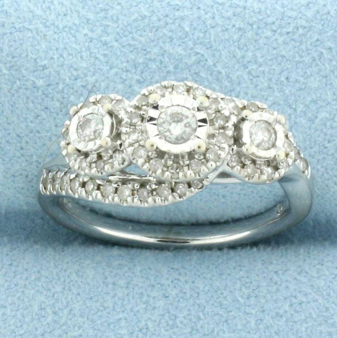 Unique Diamond Three Stone Wedding Ring in 10k Yellow Gold: In 10k white gold. Contains one .08ct, two .04ct, and fifty six 1/2pt high quality diamonds, 1/2ct TW, I color/I clarity. Size 7 1/2. 4.4g.