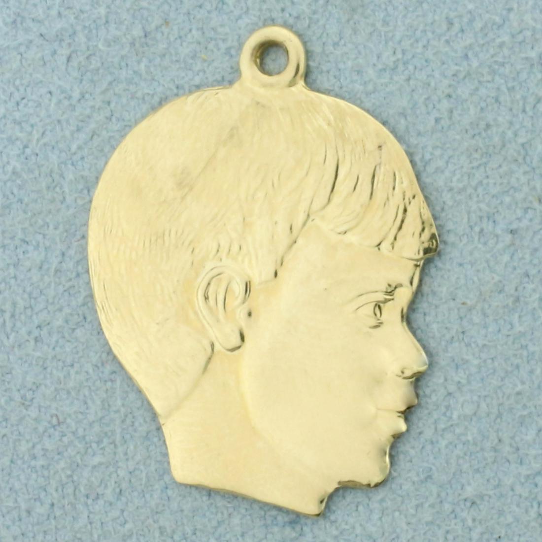 Boy Silhouette Pendant in 14K Yellow Gold: In 14K Yellow Gold. 1 inch long. Can inscribe name or date on back. 2.1g.