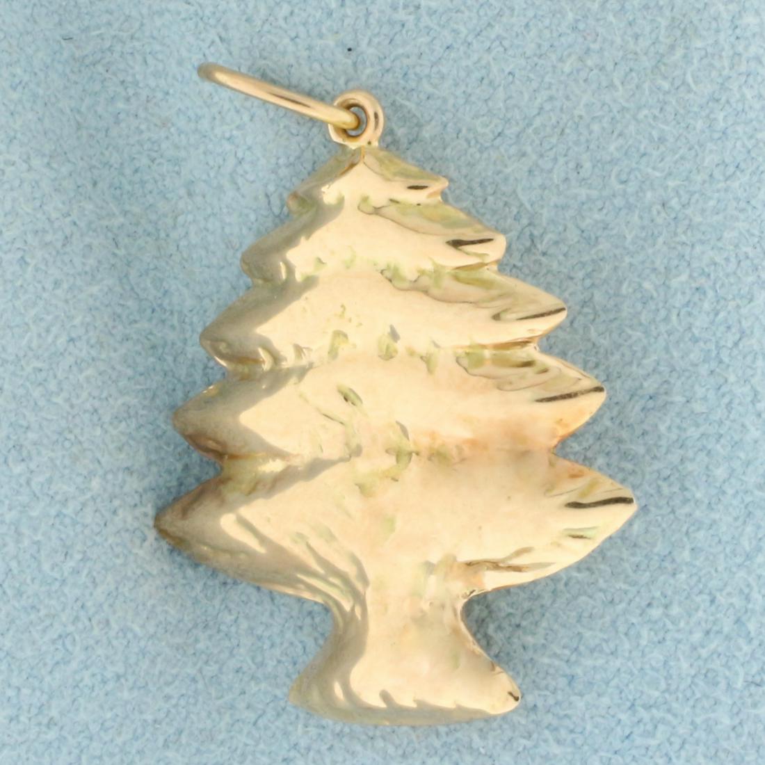 Christmas Tree Pendant in 14K Rose Gold: In 14K Rose Gold. 1 1/8 inches long, with bale, 7/8 inch wide. 1.2g.