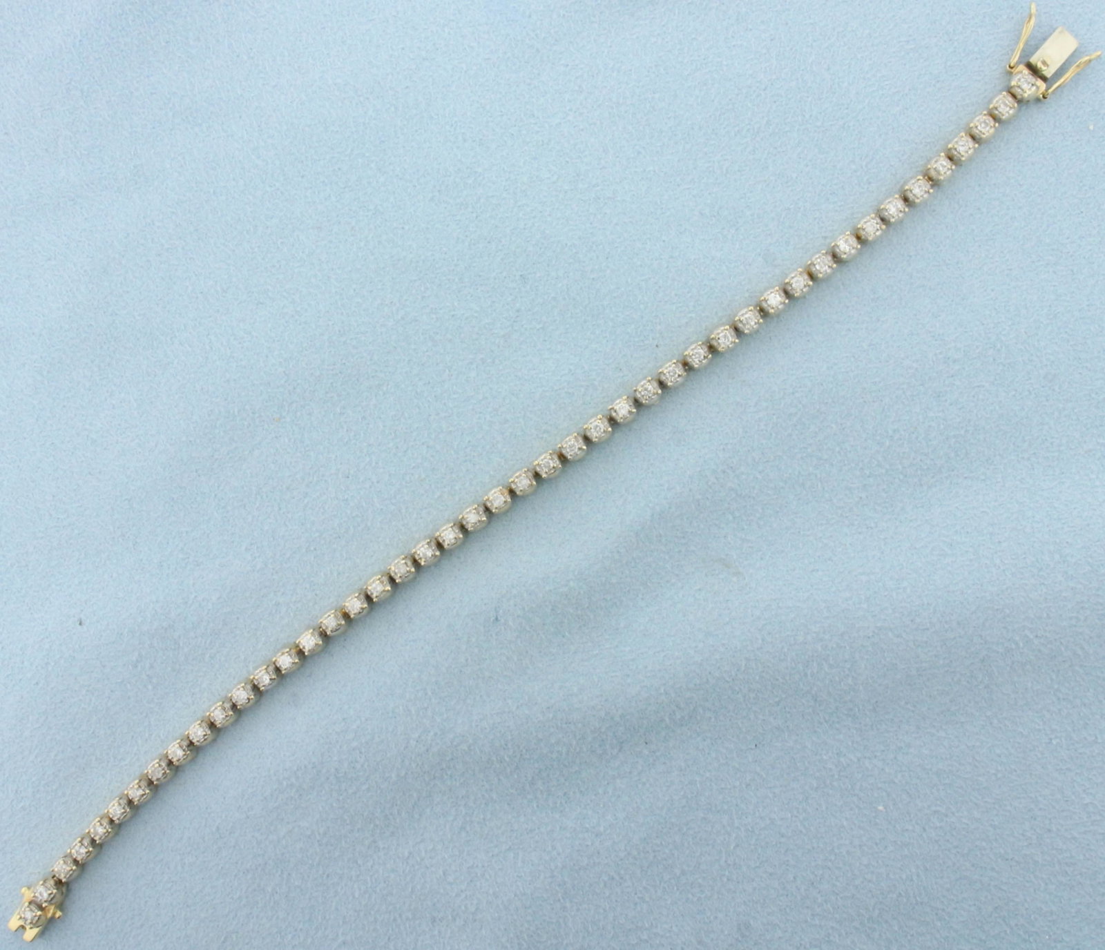 1ct Diamond Tennis Bracelet in 14k Yellow Gold: In 14k yellow gold. Contains 45 high quality round brilliant diamonds, 1ct TW, I color/I clarity. 7 1/2 inches long. Double safety clasp. 13.3g.