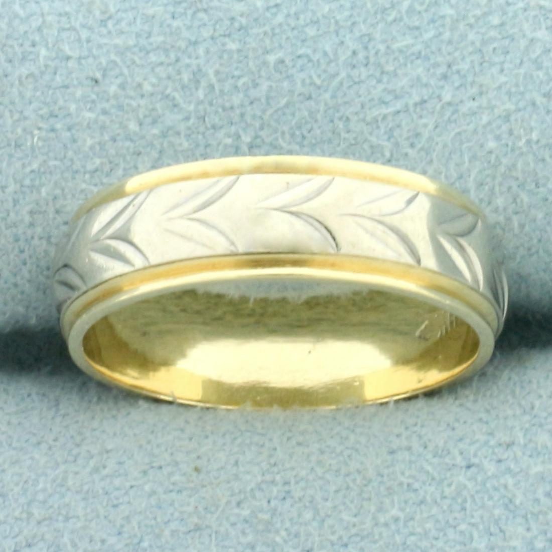 Leaf Design Two Tone Wedding Band Ring in 14k White and Yellow Gold: In 14k White and Yellow Gold. 5.5mm Wide. Size 7. 4.3g.
