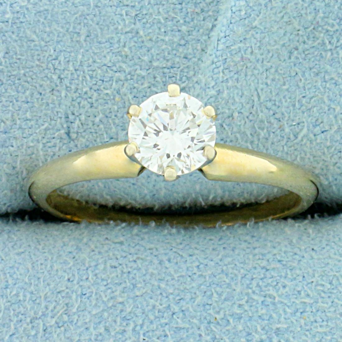 2/3ct Solitaire Diamond Engagement Ring in 14K Yellow Gold: In 14K Yellow Gold. Contains one high quality .66ct Round Brilliant Diamond, VS Clarity/G color. Great cut for tons of sparkle. Size 7 1/4. 2.1g