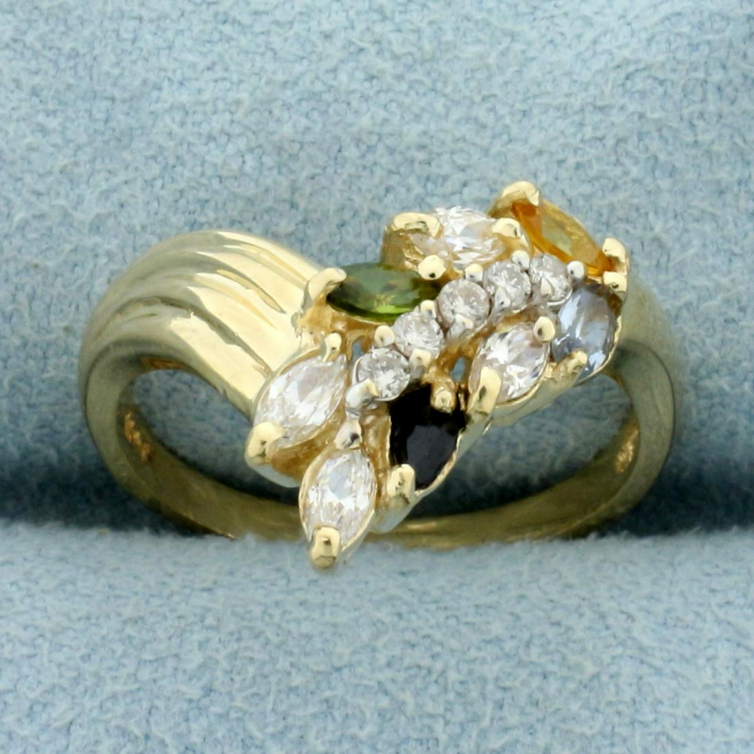 Diamond and Colored Gemstone Wheat Design Ring in 14K Yellow Gold: In 14K Yellow Gold. Contains five .01ct round diamonds, I color/I clarity. Also contains eight high quality natural 4x2mm marquise gemstones: one Sapphire, one Peridot, one Citrine, one Blue Topaz, an