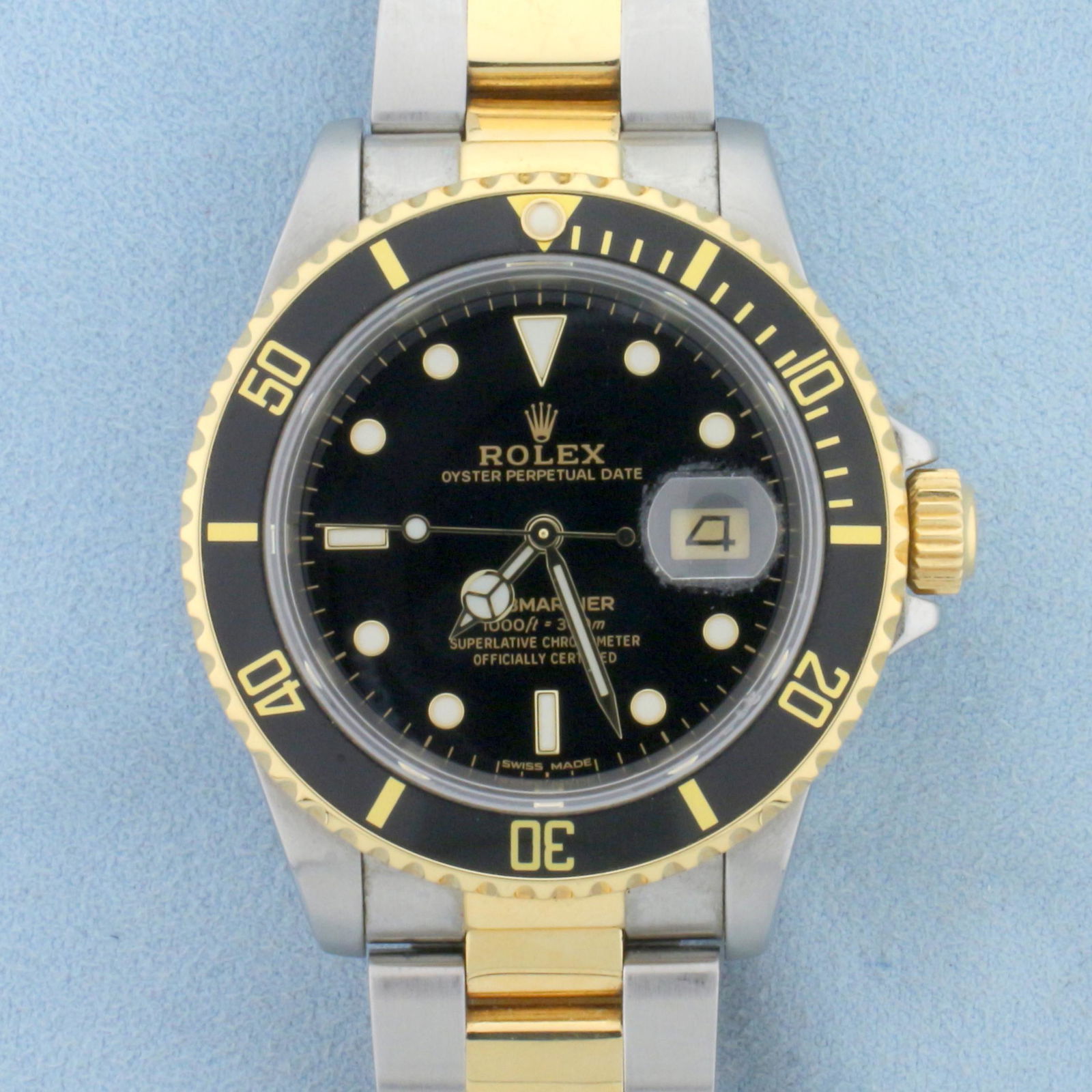 Rolex Submariner Watch Black Dial Model 16803: Watch in excellent condition, very little stretch on band, no scratching on crystal. Was just serviced at Rolex authorized dealer so movement is in pristine shape as well. 40mm case. Black dial. 18k a