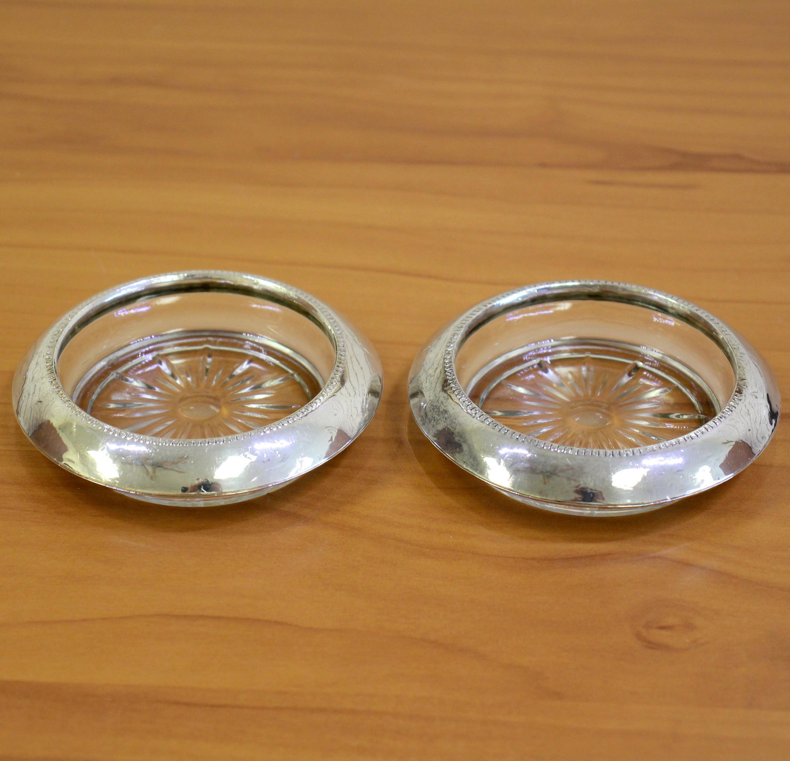 Two Vintage Sterling Silver and Glass Ashtrays: Pair of ashtrays in sterling silver and glass. 4 inch wide. 310.6g
