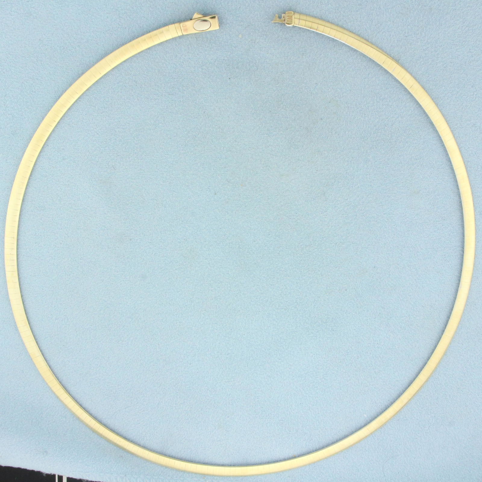 Italian Reversible Omega Link Necklace in 14k Yellow and White Gold: In 14k yellow and white gold. 18 inches long by 4.3mm wide. Button clasp for easy putting on/taking off. 20.6g.