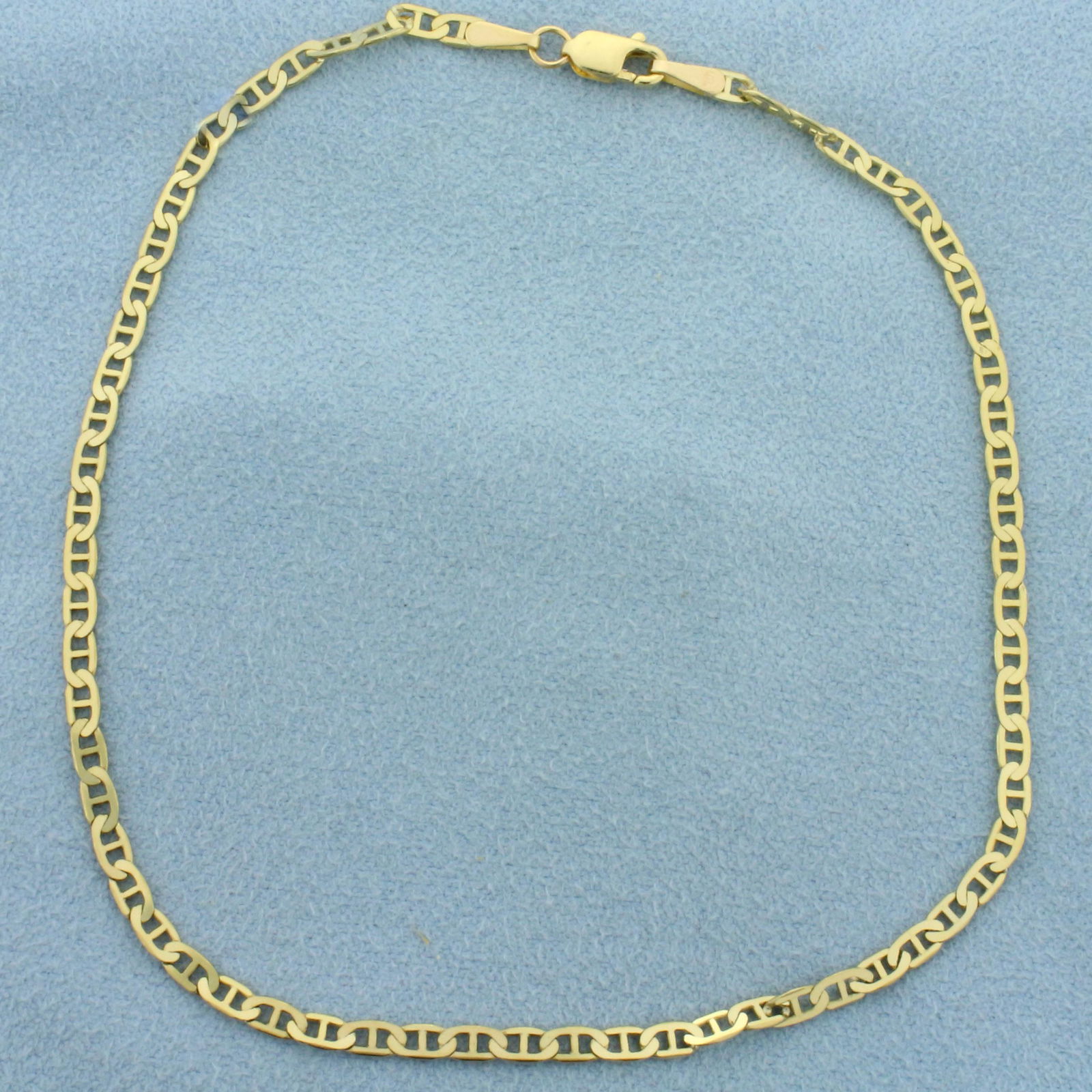 9 1/2 Inch Anchor Link Anklet in 10k Yellow Gold: In 10k yellow gold. Measures 9 1/2 inches long, 2.5mm wide. Lobster clasp. 2.5g.