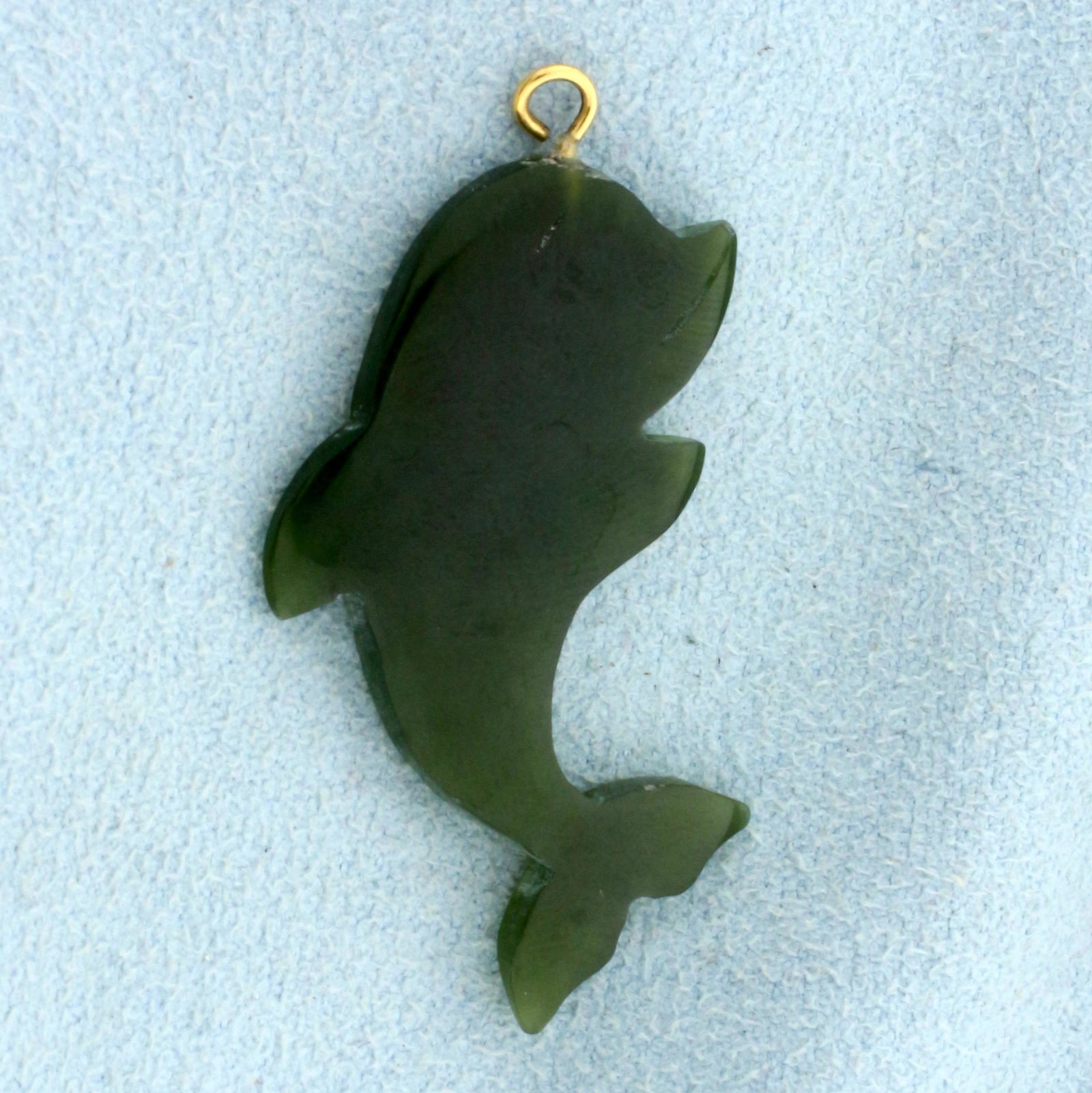 Dolphin Jade Pendant in 14K Yellow Gold: 14K Yellow Gold Bale. Contains a high quality natural 35x19mm dolphin-shaped Jade gemstone with uniform forest green color. 1 5/8 inches long with bale. 2.8g