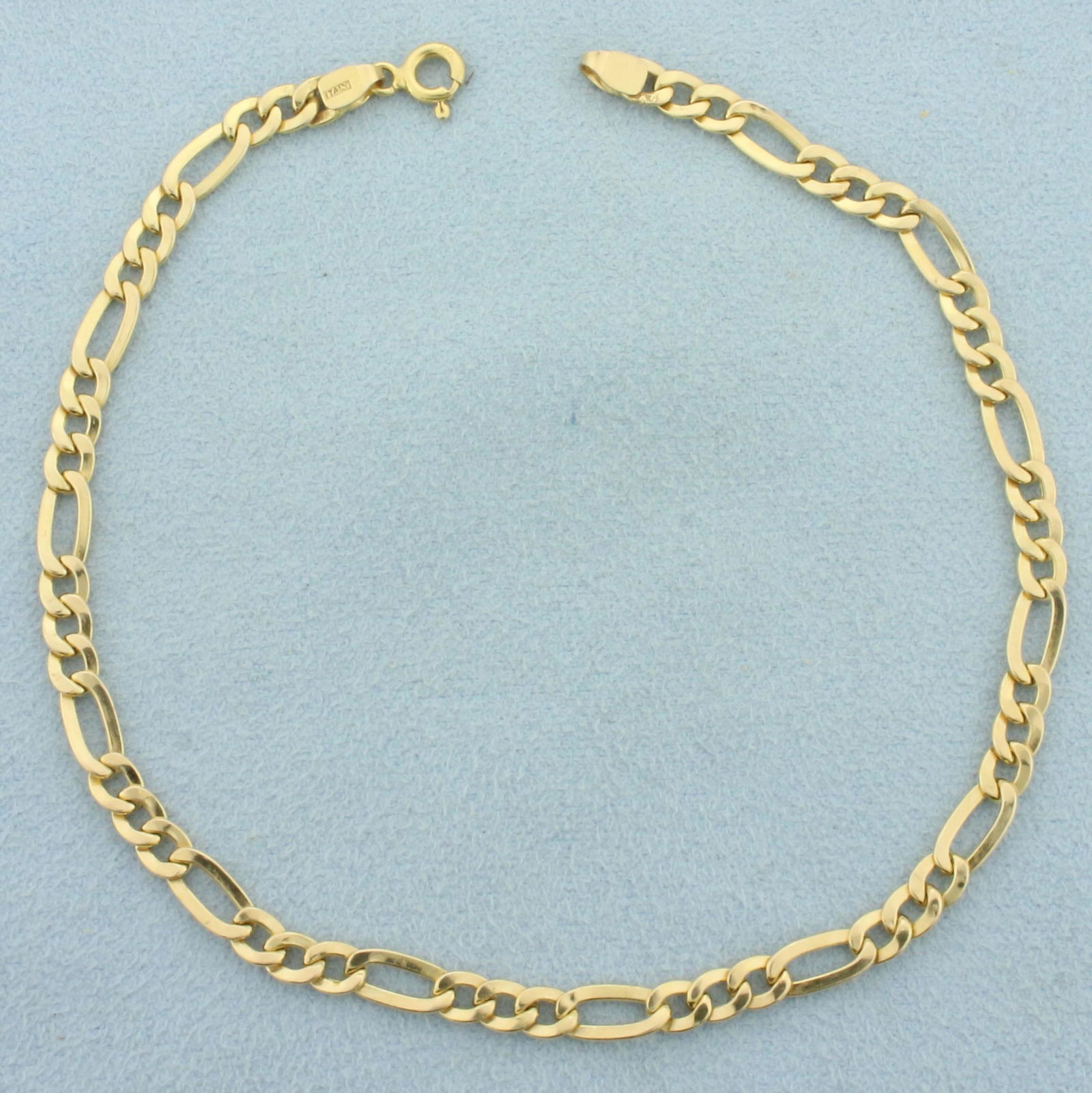 Italian Figaro Link Anklet in 14k Yellow Gold: In 14k yellow gold. 9 inches long, 4.2mm wide. Spring clasp. 3.1g.