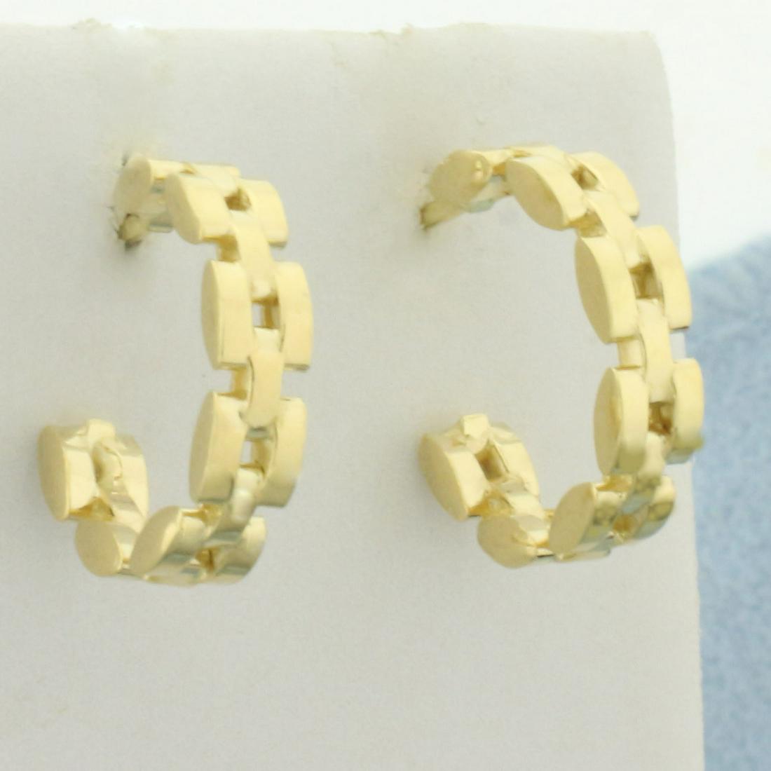 Panther Presidential Link J Hoop Earrings In 18k Yellow Gold: In 18k yellow gold. Measures approximately 1/2 inch in diameter, 3.5mm wide. Friction backs. 3.3g.