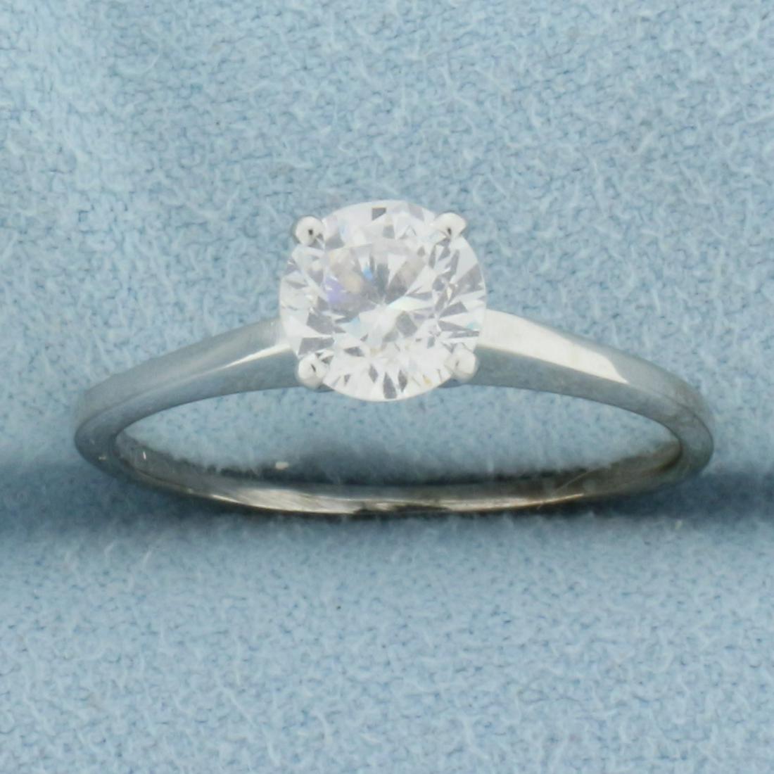 1ct Synthetic Diamond Solitaire Engagement Ring in 14k White gold: In 14k White gold. Contains one 1ct Synthetic Diamond with excellent clarity and lots of sparkle. Size 8. 2.4g.