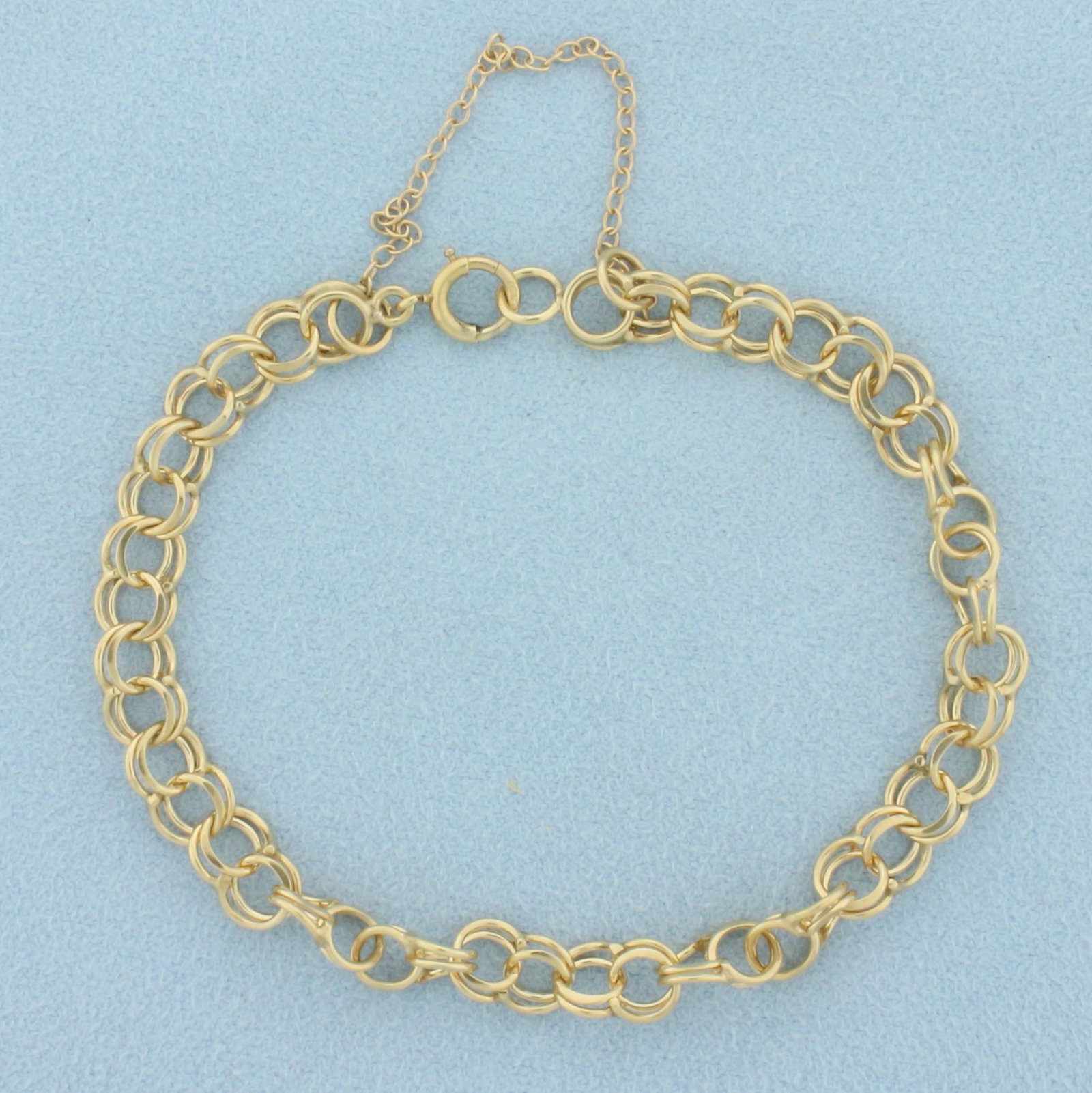 Double Cable Link Charm Bracelet in 14k Yellow Gold: In 14k yellow gold. 7 inches long, 6.3mm wide. Safety chain, spring clasp. 7.0g.