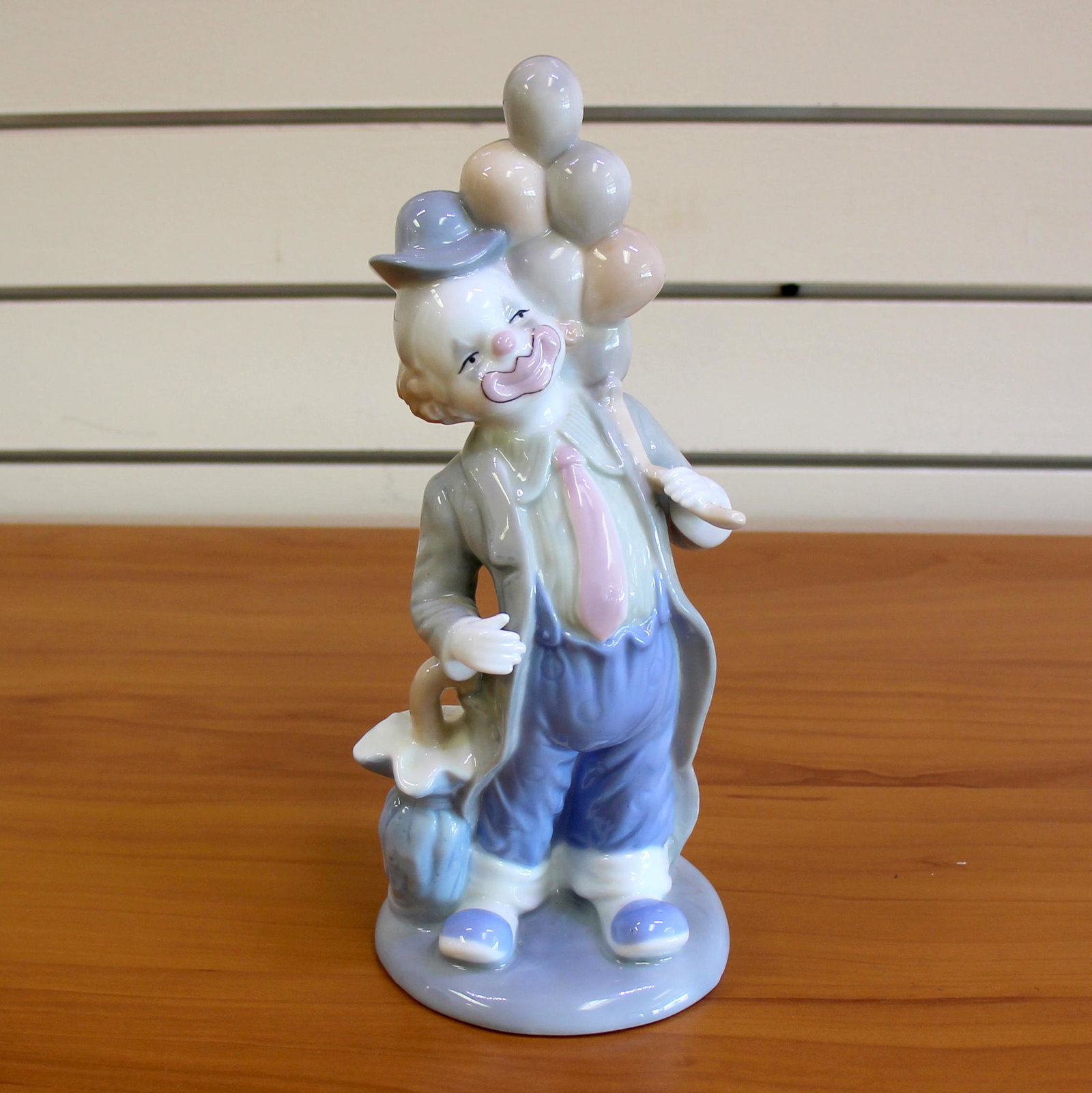 Porcelain Clown With Balloons and Umbrella: 10 Inches High. High quality porcelain.