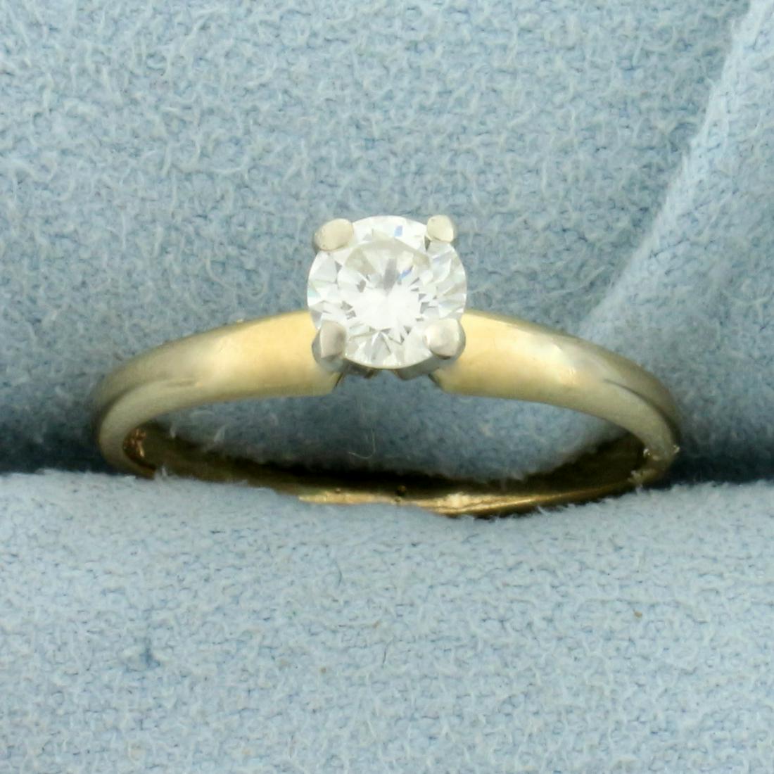 Diamond Solitaire Engagement Ring in 14K Yellow Gold: In 14K Yellow Gold. Contains one high quality .4ct Round Brilliant Diamond, VS1 clarity/J color, great cut for lots of sparkle. Size 5 1/2. 1.8g