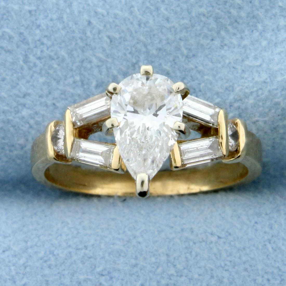 1.5ct TW Pear Diamond Engagement Ring in 14K Yellow Gold: In 14K Yellow Gold. Contains a high quality 1 ct pear diamond. Also contains four high quality .09ctbaguette and two .05ct round brilliant diamonds. All diamonds are SI1 clarity/H color. Size 6 1/2. 3