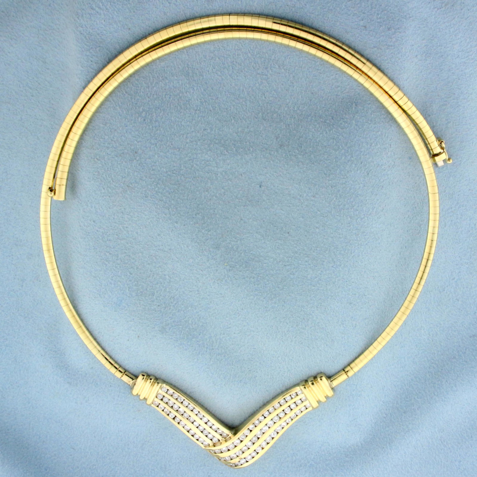 2ct TW Diamond Omega Link Necklace in 14K Yellow Gold: In 14K Yellow Gold. Contains eighty-six high quality Diamonds, 2ct TW, VS clarity/G color. 20 inches long, Omega chain is 3.2mm wide, with a safety clasp. 35.0g.