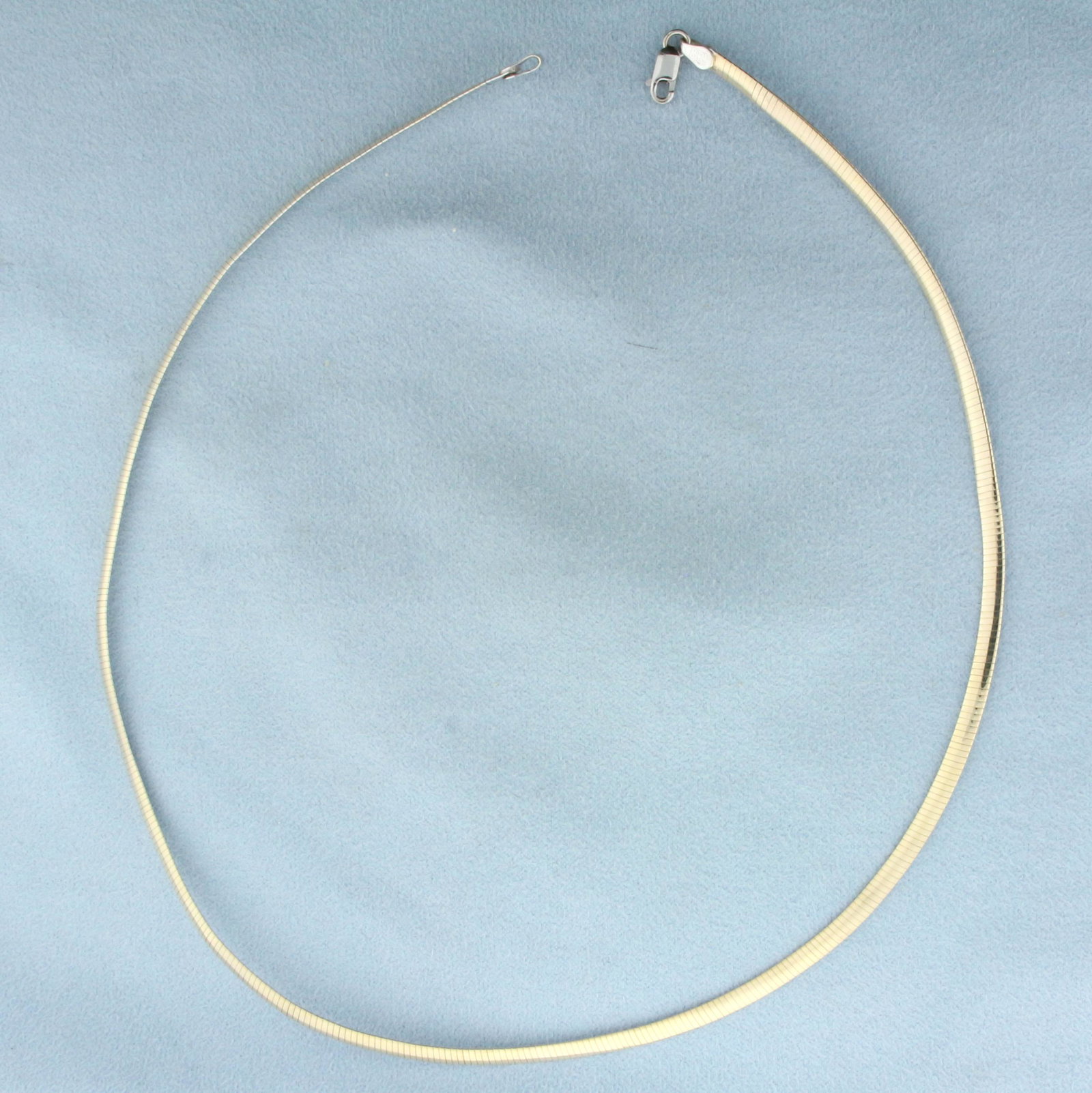 Italian 16 Inch Reversible Omega Link Chain Necklace in 10k Yellow and White Gold: In 10k Italian yellow and white gold. Measures 16 inches long, 3mm wide. Reversible, can be worn on yellow or white side. Lobster clasp. 6.8g.