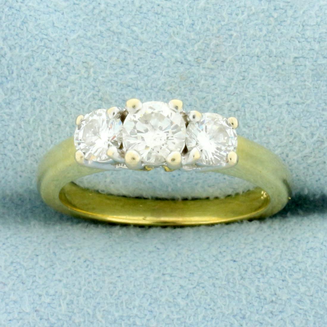 3 Stone Diamond Wedding or Anniversary Ring in 18K Yellow Gold: In 18K Yellow Gold. Contains one .4ct and two .25ct high quality round brilliant Diamonds, SI clarity/H color, great cut for lots of sparkle. Size 6 1/4. 5.3g.