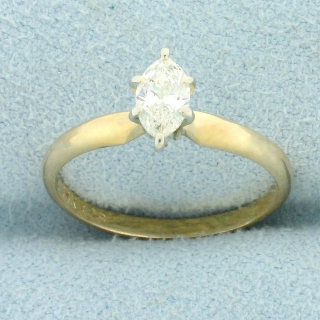 Solitaire Marquise Diamond Engagement Ring in 14K Yellow Gold: In 14K Yellow Gold. Contains one high quality .4ct marquise cut Diamond, J color/I clarity, eye clean, and great cut for lots of sparkle. Size 6. 1.9g.