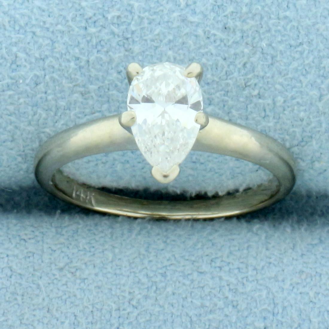 1ct Pear Diamond Solitaire Engagement Ring in 14K White Gold: In 14K White Gold. Contains one high quality 1ct pear shaped diamond, VVS clarity/I color, great cut for lots of sparkle. Size 4. 2.1g.